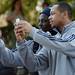Michigan senior quarterback Denard Robinson and wide receiver Roy Roundtree take photos with their iPhones while on a team outing at Busch Gardens in Tampa, Fla. on Saturday, Dec. 29. Melanie Maxwell I AnnArbor.com